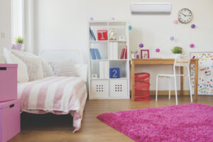 pink child's bedroom with ductless air conditioning on wall