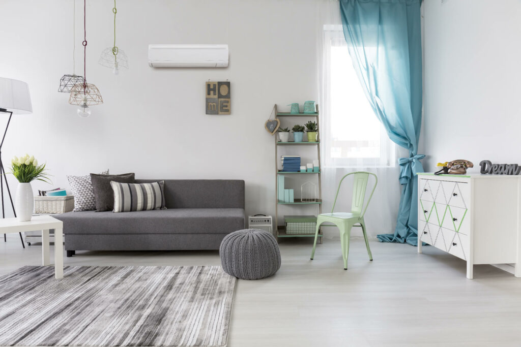 Ductless unit installed on a wall in a living room.