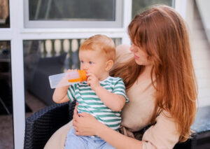 woman and baby wait for AC repairs 