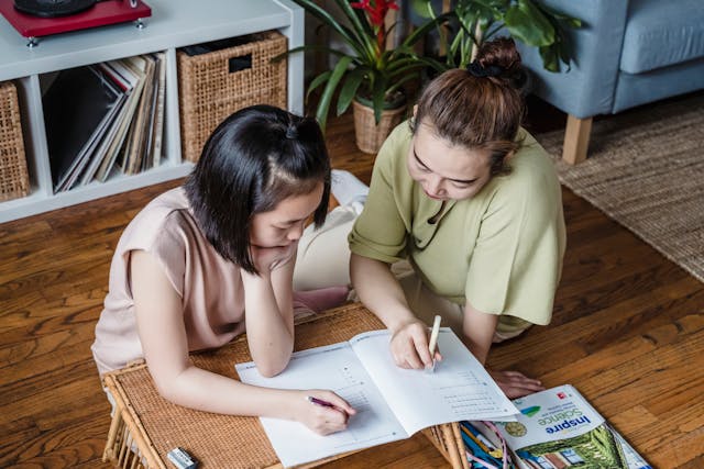 mom and daughter working on schoolwork