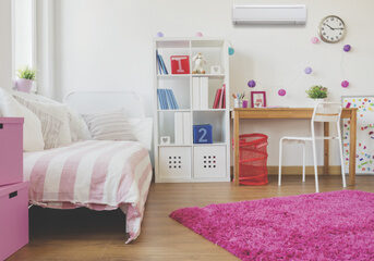 pink child's bedroom with ductless air conditioning on wall