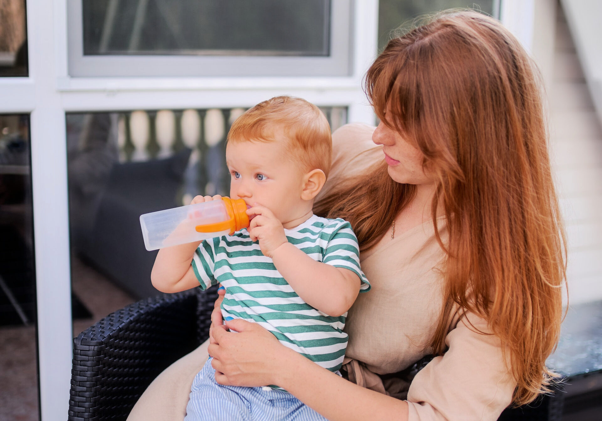 woman and baby wait for AC repairs